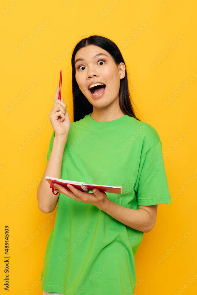 pretty brunette posing red notepad learning isolated background unaltered pretty brunette posing red notepad learning isolated background unaltered