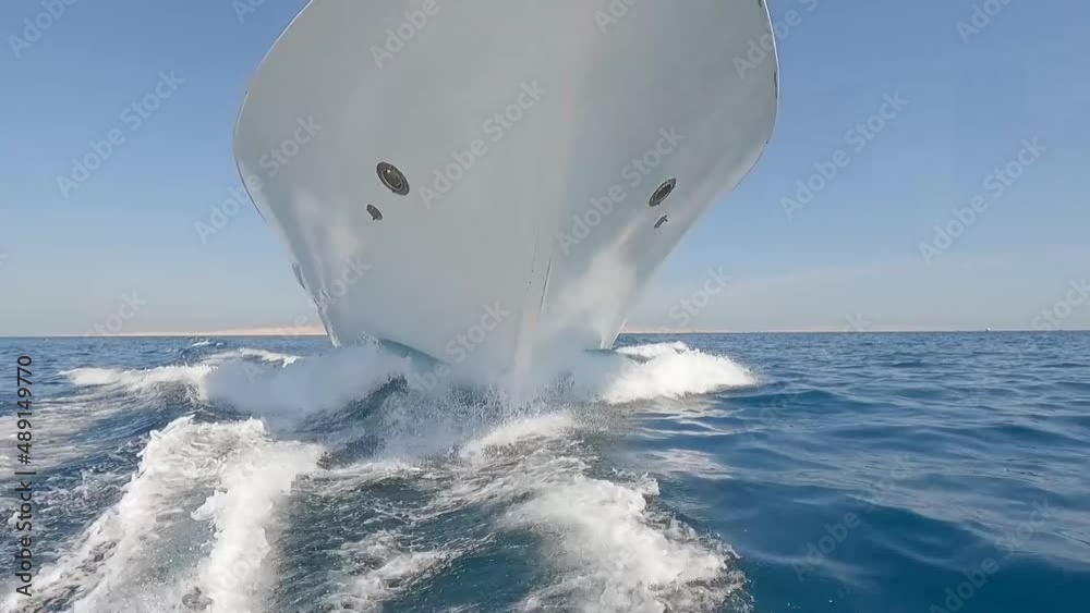 Luxury private motor yacht under way sailing at sea