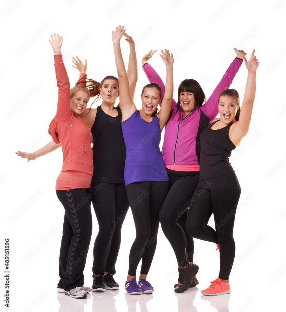 Staying fit is a group effort here. A group of excited women of different body shapes standing isolated on white while wearing sportswear.