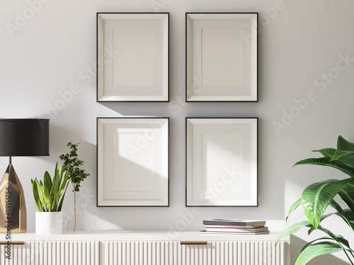 Mockup blank 4 black picture frame gallery on the white beige  wall in a contemporary living room with sideboard in morning sunlight. 3D render for poster frame template. photo