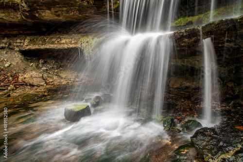 Oglebay Falls, a beautiful cascading waterfall within Oglebay Park in Wheeling, West Virginia, in seen splashing onto and over a rocky ledge.