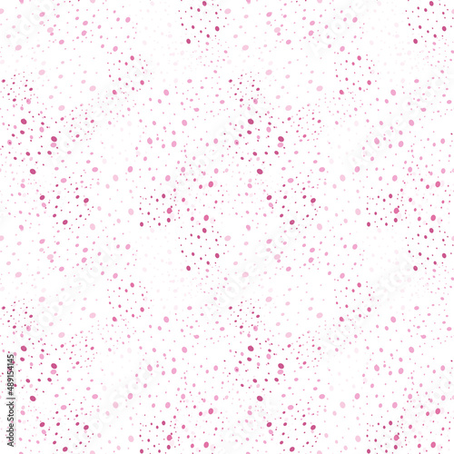 Seamless texture with blots of pink color. Background with small specks in the form of splashes. Vector.