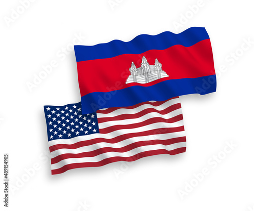 National vector fabric wave flags of Kingdom of Cambodia and USA isolated on white background. 1 to 2 proportion.