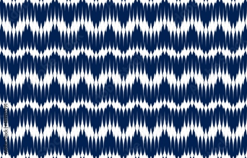 Ethnic abstract ikat art. Seamless pattern in tribal, folk embroidery, and Mexican style. Aztec chevron art ornament print.Design for carpet, wallpaper, clothing, wrapping, fabric, cover, textile