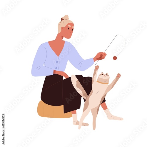 Person playing with cute cat. Pet owner and playful kitty during game with to...