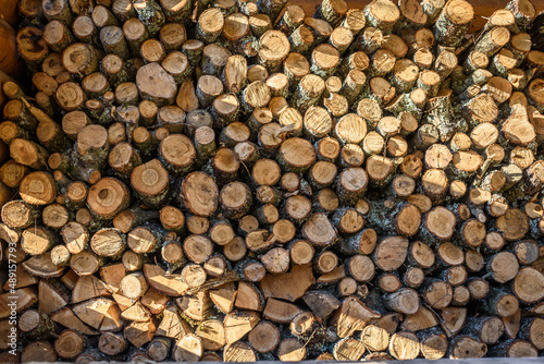 Natural wooden background - closeup of chopped firewood