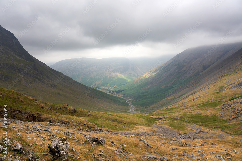 Distant views of Wasdale Head valley, Yewbarrow and Kirk Fell from Sty Head in the English Lake District, UK.