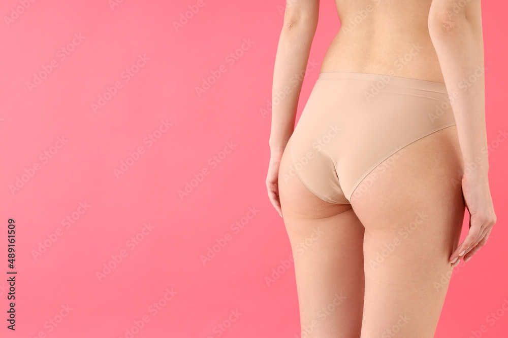 Concept of weight loss with young slim woman on pink background