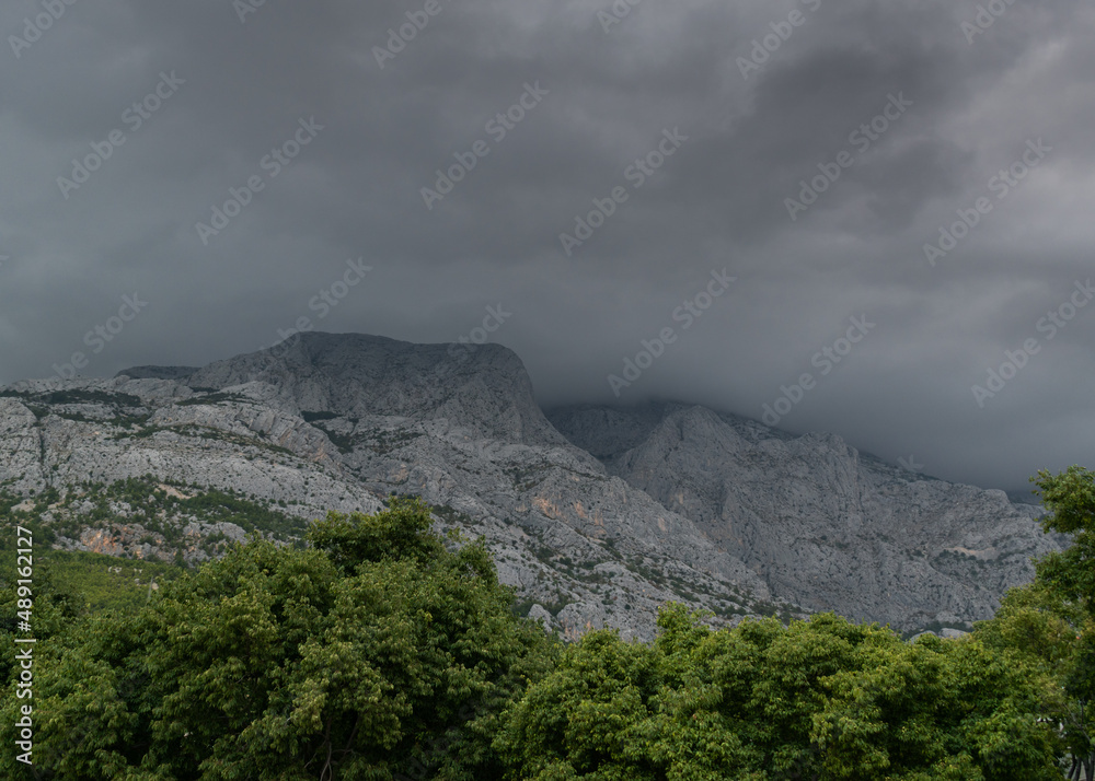Mountain Biokovo disappears in the dark clouds in Croatia