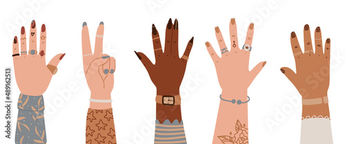 Women hands different nationalities. International Women's Day, 8 March greeting card, banner. Set of hands raised up. Group of diverse arms with rings, accessories, tattoo, manicure
