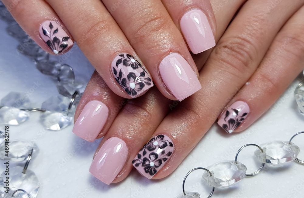 modern painted gel nails in closeup modern painted gel nails in closeup