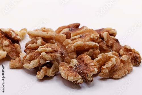 a pile of walnuts on a white background