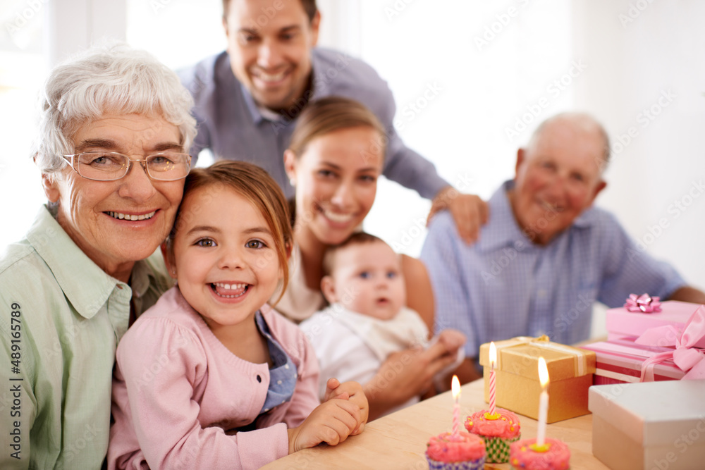 Wishing for a pony. Grandparents sitting with their granddaughter on her birthday. Wishing for a pony. Grandparents sitting with their granddaughter on her birthday.
