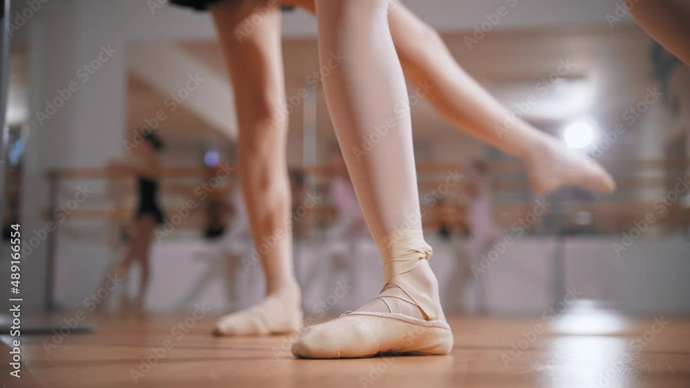 Ballet training - ballerina girls training their stands on pointe shoes Ballet training - ballerina girls training their stands on pointe shoes
