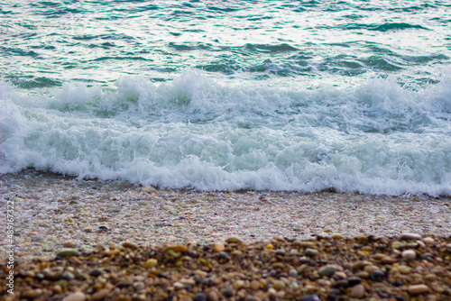 Fototapeta Naklejka Na Ścianę i Meble -  the sea wave washes up to the shore