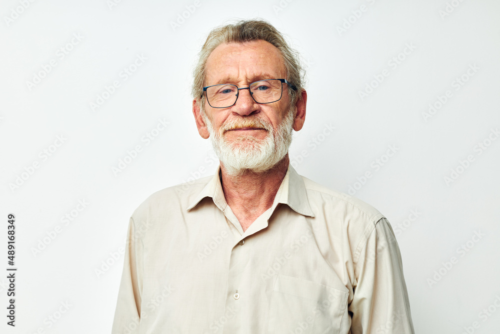 Senior grey-haired man smile emotion hand gesture light background Senior grey-haired man smile emotion hand gesture light background