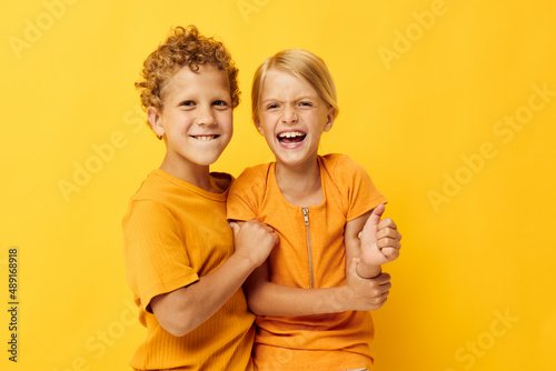 Boy and girl cuddling fashion childhood entertainment isolated background unaltered