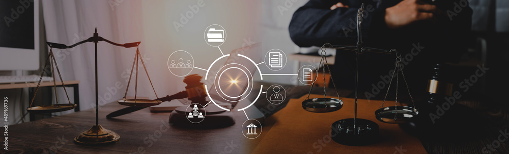 Fototapeta premium Business and lawyers discussing contract papers with brass scale on desk in office. Law, legal services, advice, justice and law concept