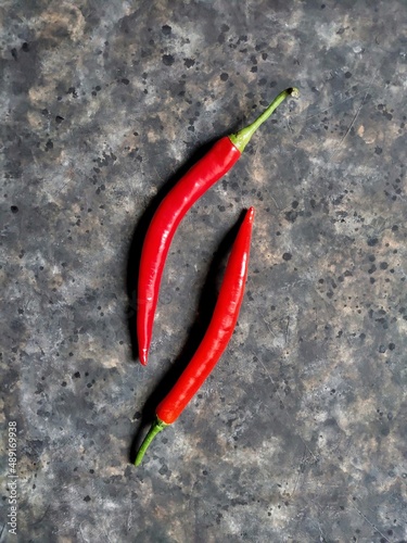 red hot chili peppers on the rusty concrete background with copy space