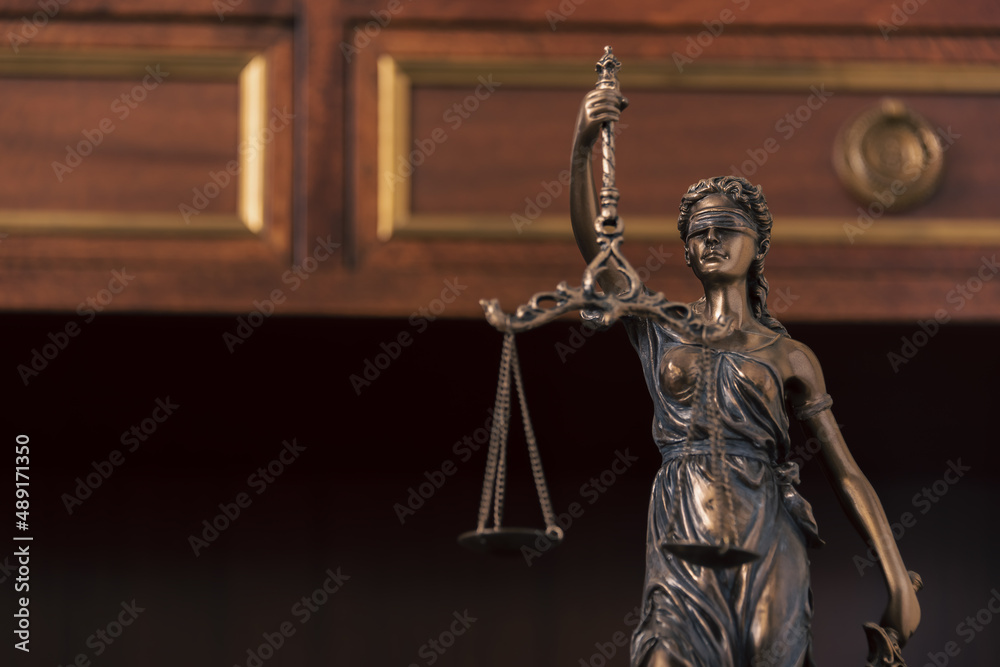 detail of lady justice statue with scales and blindfold. detail of lady justice statue with scales and blindfold.