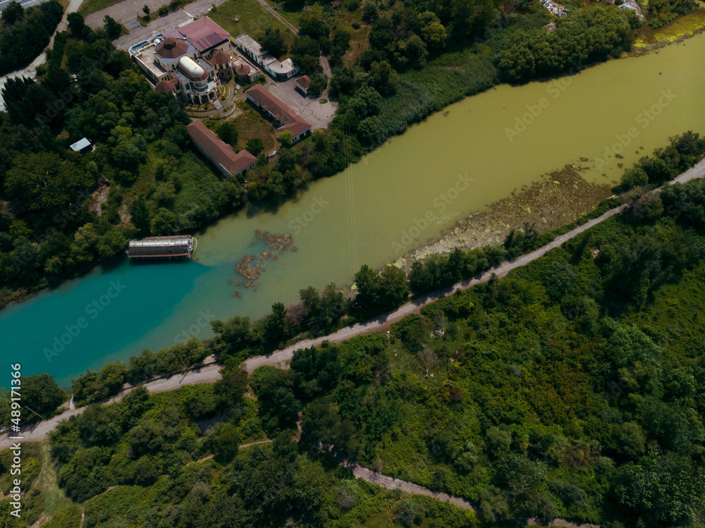 A place where two rivers of different colors meet. Aerial view panorama. Mountains. Travel and vacation concept. Summer day. Mtskheta in Georgia.