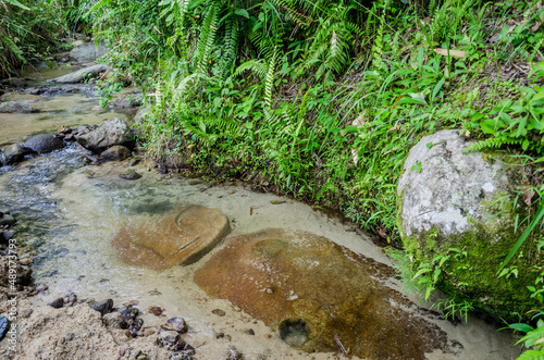 Views in detail of the megalith or 
Megalitik Palindo, Tadulako, Pokekea, Sleeping, Sepe located in Poso Regency, also rice fields and markets. Sulawesi. photo