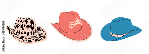 Set of сartoon сowgirl hats with cow print, diadem, crown. Wild West fashion style. Cowboy western theme; wild west concept. Hand drawn colored flat vector illustration. All elements are insolated