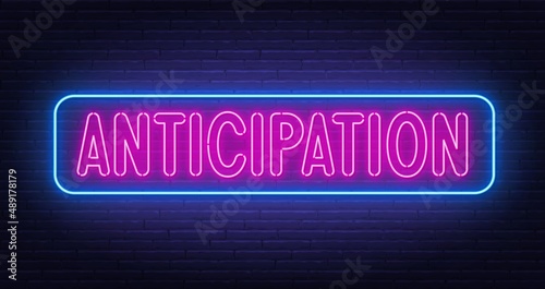 Neon sign Anticipation on brick wall background. photo