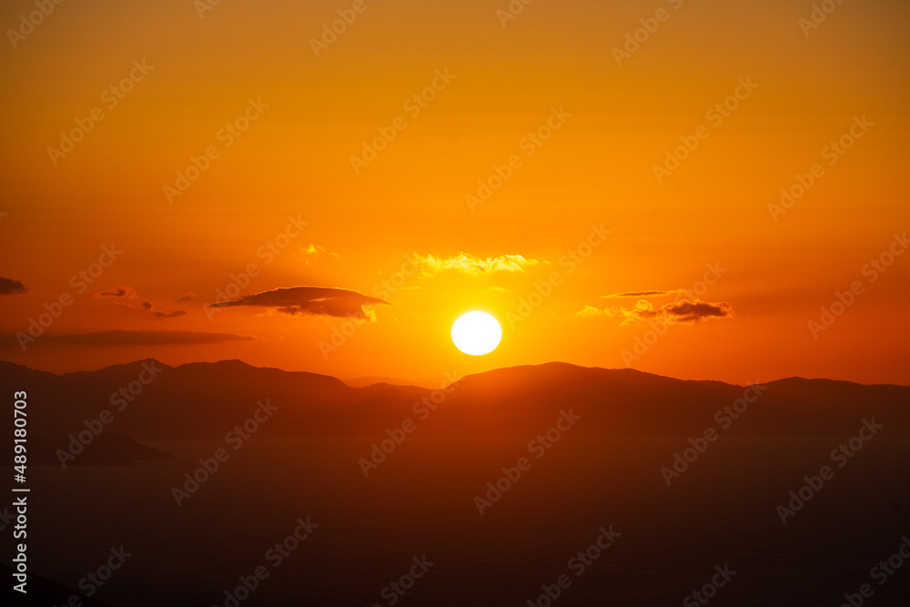 Sun setting on a mountain horizon at the Basque Country.