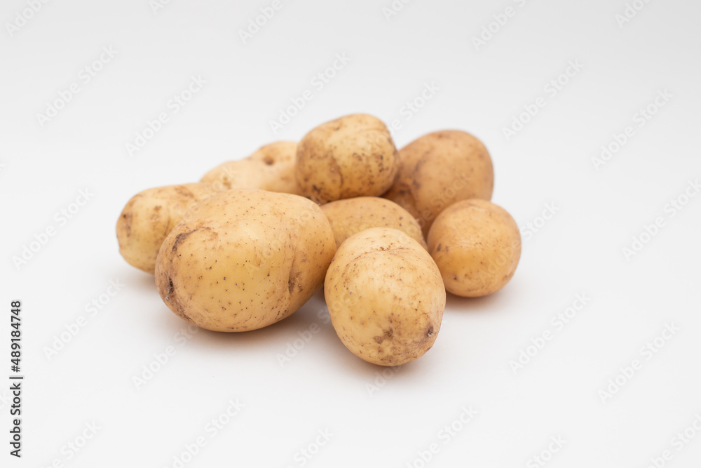 Fresh young potato on white background Fresh young potato on white background