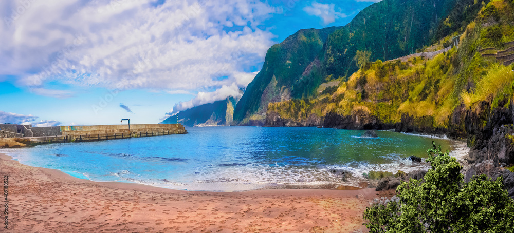 Panorama of the coastline and Cais do Seixal volcanic beach in Madeira island, Portugal