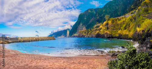 Panorama of the coastline and Cais do Seixal volcanic beach in Madeira island, Portugal
