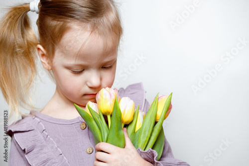 girl with a bouquet of tulips on a white background