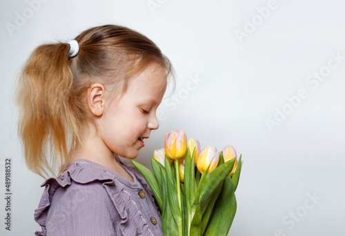 girl with a bouquet of tulips on a white background