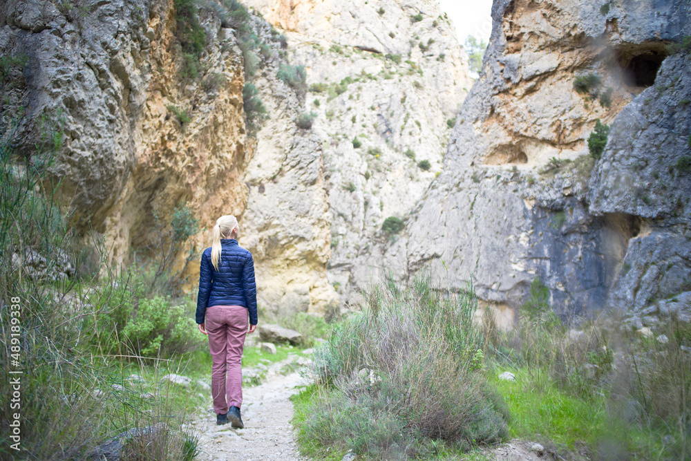 a young woman is walking in the baranco der Cint a young woman is walking in the baranco der Cint