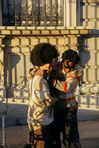 Gay couple laughing.