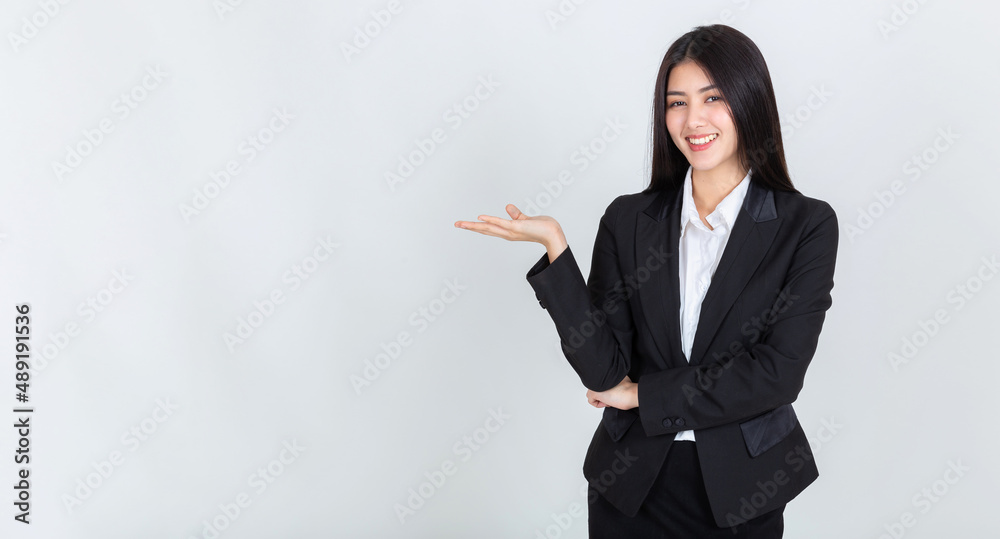 asian woman hands pointing to copy space for your promotional or text on white background. asian woman hands pointing to copy space for your promotional or text on white background.