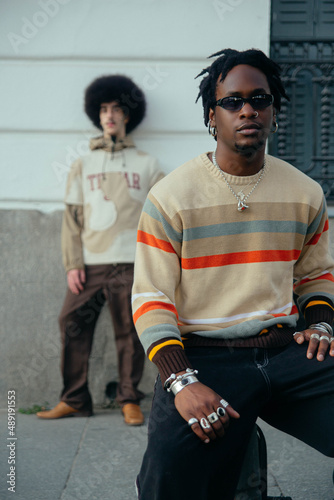 Gay couple sitting outside.