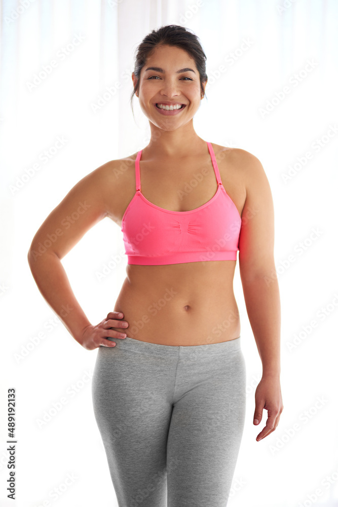 Healthy body, healthy mind. Cropped shot of a young woman in exercise clothing against a white background. Healthy body, healthy mind. Cropped shot of a young woman in exercise clothing against a white background.