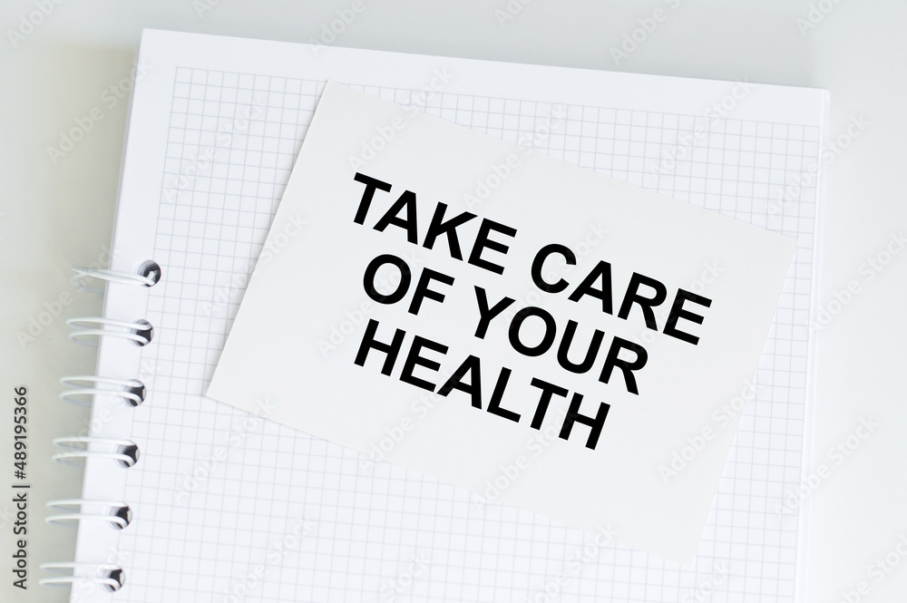 medical concept. Take care of your health inscription on a white card on a notepad medical concept. Take care of your health inscription on a white card on a notepad