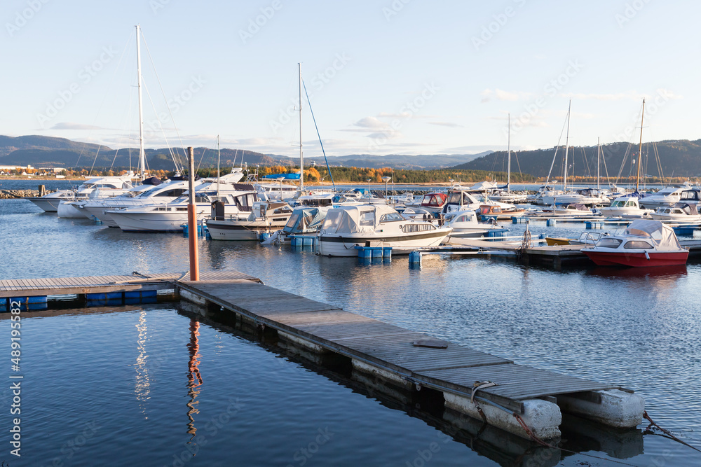 Small motor boats are moored in Norwegian marina