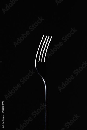 Fototapeta fork on black background