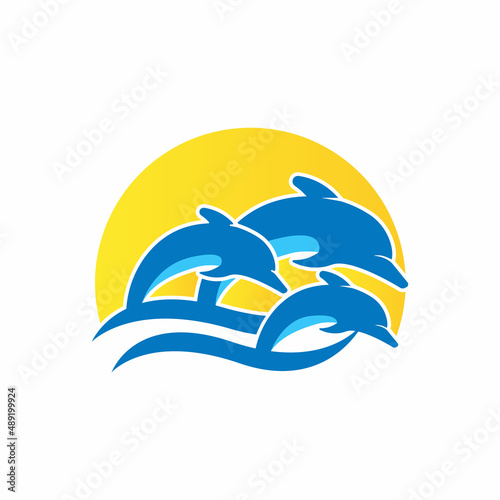 Dolpins jump water logo and symbol with sunset