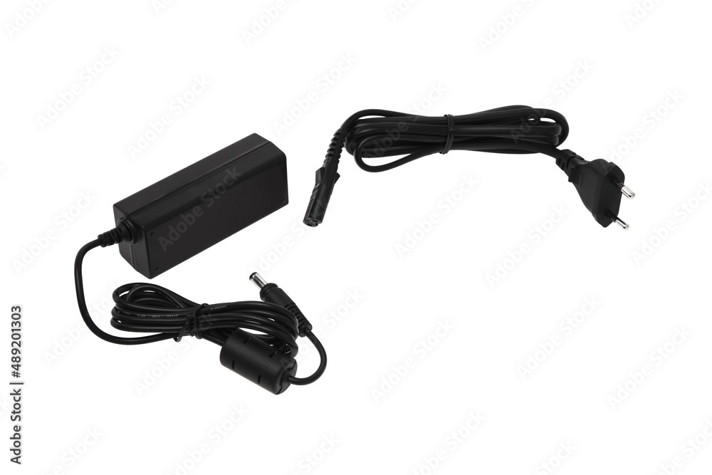 Power supply for various electronics. A device for converting AC 220 volts to DC. Isolate on a white back Power supply for various electronics. A device for converting AC 220 volts to DC. Isolate on a white back