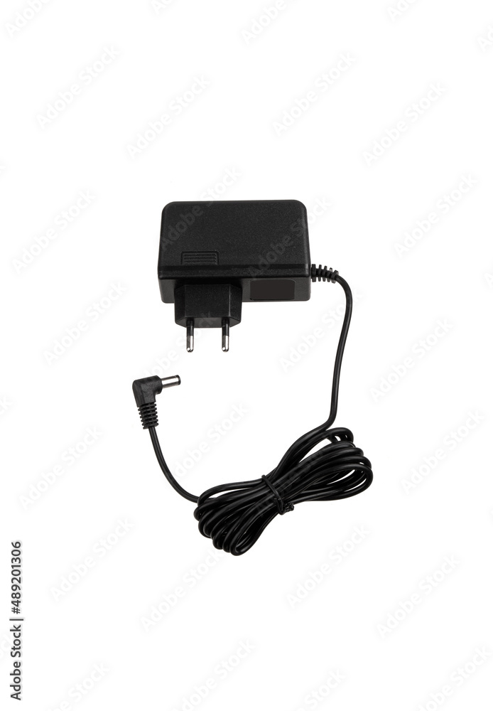 Power supply for various electronics. A device for converting AC 220 volts to DC. Isolate on a white back Power supply for various electronics. A device for converting AC 220 volts to DC. Isolate on a white back
