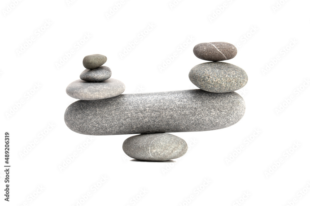 Pyramid of the balanced grey stones isolated on white background. Pyramid of the balanced grey stones isolated on white background.