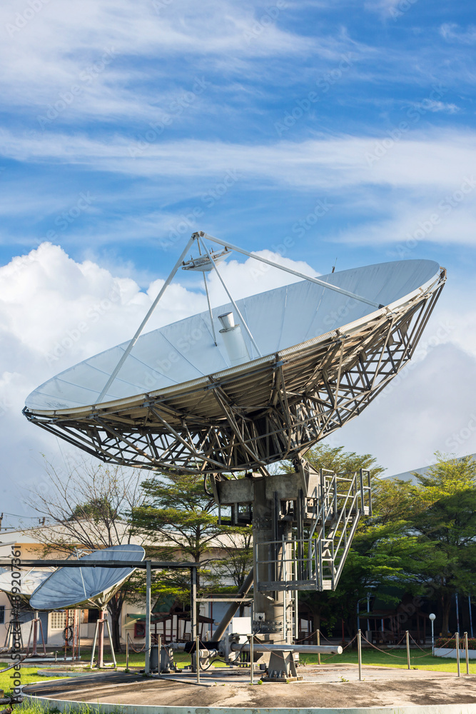 satellite dish radar antenna station in field. parabolic antennas. Big parabolic antenna against sky. Satellite dish at earth station with a sky.