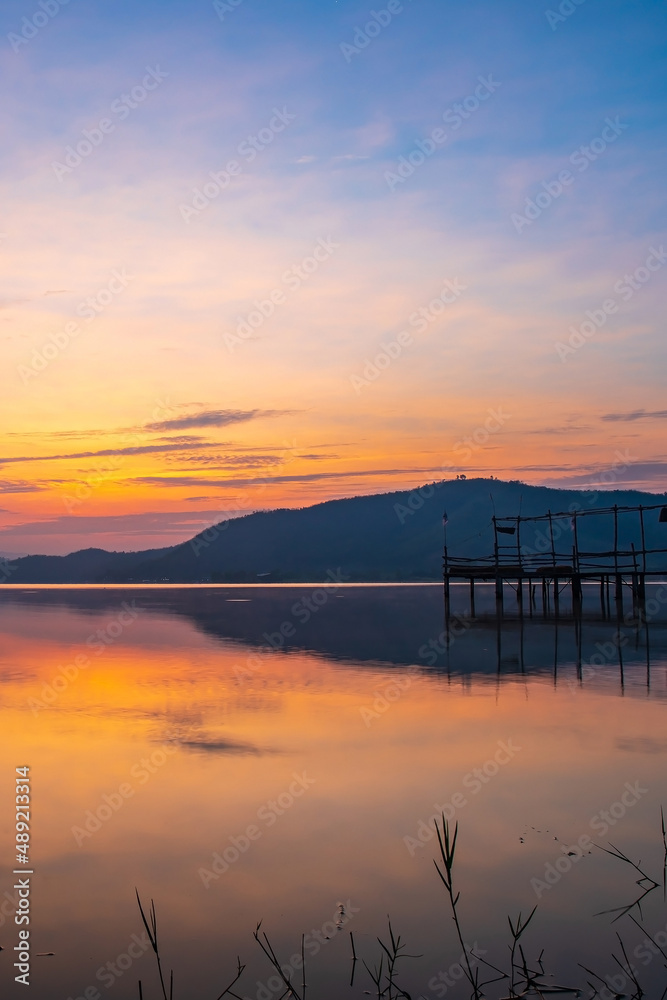 Landscape photo of Lake and mountain on the background in the morning time. and wooden bridge.