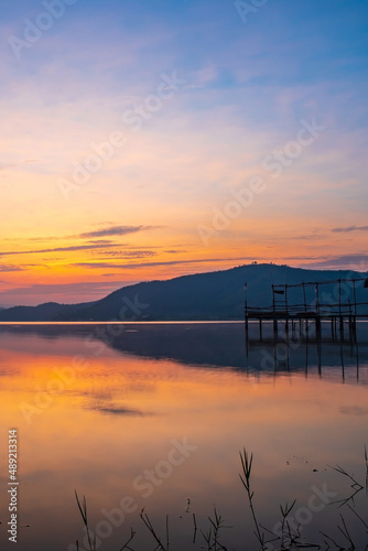 Landscape photo of Lake and mountain on the background in the morning time. and wooden bridge.