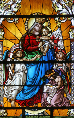 Virgin Mary with baby Jesus and Angels, stained glass window in the Saint John the Baptist church in Zagreb, Croatia